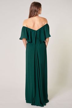 Classic and charismatic in this tasteful maxi dress. An off the shoulder ruffle creates a straight neckline that drapes over an elastic waist that separates a flowy natural A line silhouette. A classy dress that accentuates the shoulders, creating balance between the top and bottom half. - Ruffle drape- Elastic waist- Shirred- Lined- Comes in 7 ColorsSize + Fit - Model is 5'10" and wearing size S- Measurements taken from size S - Chest: 33 1/2"- Length: 56" Fabric Self: 100% PolyesterLining: 97% Off The Shoulder Ruffle Dress, Line Silhouette, Shoulder Ruffle Dress, Boho Bridesmaid, Convertible Dress, Straight Neckline, Green Baby, Classy Dress, Sweater Weather