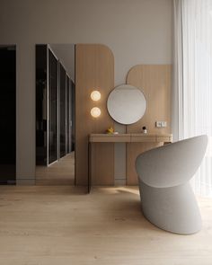 a modern bathroom with wooden flooring and white walls, along with a round mirror on the wall