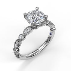 a white gold engagement ring with an oval diamond center and twisted shans on the band