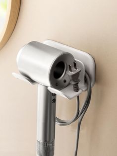 a hair dryer is plugged into the wall