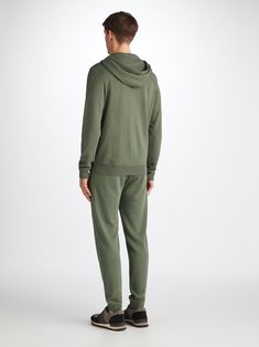 Our Quinn hoodie is stylish, yet practical. Featuring zipped front pockets with welts and with ribbed cuffs and neck trim, this hoodie is designed to hold its shape wash after wash. The Quinn fabric combines all the key qualities of our cotton and micro modal; it's durable and has great colour retention, meaning it can withstand long-lasting wear and this soft green colour won't fade. It's thermoregulating, making it perfect for warm days or cosy evenings in and it's breathable, so it's perfect Relaxed Fit Hooded Tracksuit With Drawstring, Hooded Hoodie With Ribbed Cuffs For Loungewear, Casual Track Jacket With Hoodie And Ribbed Cuffs, Casual Hoodie With Ribbed Collar For Loungewear, Sportswear Hoodie With Ribbed Waistband For Loungewear, Sporty Cotton Hooded Jacket For Loungewear, Relaxed Fit Hooded Tracksuit With Ribbed Cuffs, Solid Hoodie With Ribbed Cuffs For Loungewear, Sporty Hooded Jacket With Double-lined Hood For Loungewear