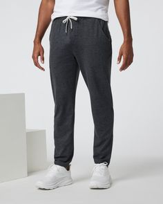 The softest performance sweatpants in our signature DreamKnit™ fabric, the Ponto Pants feature a straight-leg modern fit and endless comfort. Light, stretchy and buttery soft, you'll be wearing these pants on the plane, around the house, and in and out of class. | Vuori Ponto Performance Pants | Charcoal Heather | XS Vuori makes premium performance apparel inspired by the active Coastal California lifestyle; an integration of fitness, surf, sport, and art. Breaking down the boundaries of traditi Mastectomy Clothing, Coastal California, On The Plane, California Lifestyle, Mens Leggings, Frankies Bikinis, Body Glove, Performance Outfit, Swim Bottoms