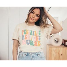 a woman wearing a t - shirt that says labor and delivery nurse