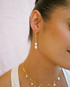 Add a touch of minimalist style with our Phoebe Pearl Threader Earrings! These delicate drop earrings feature a playful threader design that effortlessly loops through your ear for a unique & minimalist look. Adorned with freshwater pearls, they're sure to elevate any outfit! EARRINGS FEATURE ◊ Material: 14K Gold Filled or Sterling Silver threader ◊ Freshwater genuine pearls ◊ Hand wire-wrapped with 14K gold filled or Sterling Silver wire ◊ Hypoallergenic & great for sensitive skin Everyday Minimalist Pearl Drop Teardrop Earrings, Long Drop Pearl Earrings With Ear Wire For Everyday, Minimalist Pearl Drop Linear Earrings For Everyday, Everyday Long Drop Pearl Earrings With Ear Wire, Minimalist Everyday Pearl Drop Linear Earrings, Minimalist Everyday Linear Earrings With Pearl Drop, Minimalist Drop Pearl Earrings, Everyday Pearl Drop Linear Earrings, Adjustable Minimalist Pearl Earrings For Pierced Ears