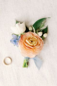 an image of a boutonniere with flowers on it