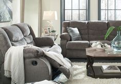 a living room with two couches and a coffee table