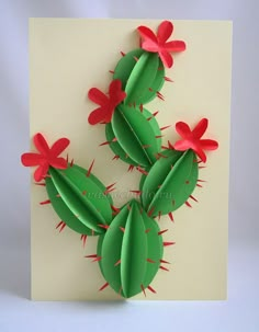 a card with three green and red cactuses on it