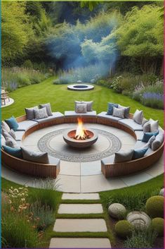 a circular fire pit surrounded by grass and rocks in the middle of a garden area