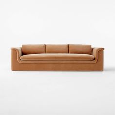 a tan leather couch on a white background