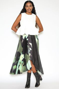 This handkerchief hem midi skirt is adorned with pleated abstract prints that add a touch of artistic flair to your ensemble. The asymmetrical line provides a modern feeling to contrast the dainty feminine prints. Crafted from a unique combination of two fabrics, the skirt features green-toned prints and see-through black silk, offering a dynamic and eye-catching look. The skirt is lined with black fabric, with an invisible zipper on the back for ease of wear. Composition: 100% Silk Mid-weight f Feminine Prints, Plaid Coat, Handkerchief Hem, Green Tones, Silk Wool, Tweed Blazer, Zambia, Wool Plaid, Anniversary Sale