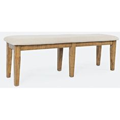 a wooden bench sitting on top of a white floor