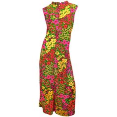 Incredible LIBERTY HOUSE 1970s plus size (current 16/18) colorful neon flower print cotton / rayon maxi dress! Features vibrant colors of hot pink, neon green, orange and yellow throughout. Chic ruffled collar with mock buttons up the center neck. POCKETS at each side of the hips. Full metal zipper up the back with hook-and-eye closure. In great condition. Made in Hawaii Approximately Size XL-XXL Measurements: 44 inch bust 46 inch waist 52 inch hips 51.5 inches from top back shoulder seam to hem 60s Mod Fashion, Liberty House, 1920 Fashion, 70s Maxi Dress, Neon Flowers, Maxi Gown Dress, Maxi Jersey Dress, Mini Robes, Pink Neon