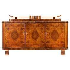 an art deco sideboard with two doors and three drawers, inlaid to the top