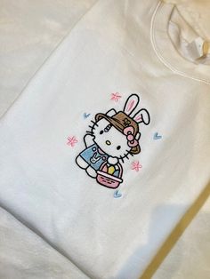 Spring/Easter hello bunny embroidered crew neck 💐 unisex - oversized, size down if you want more fitted.  50% cotton, 50% polyester  100% made with love. Cute Cotton Sweatshirt With Embroidered Logo, Cute Cotton Sweatshirt For Streetwear, Cute Cotton Sweatshirt With Embroidered Graphics, Spring Streetwear Tops With Custom Embroidery, Cute Cotton Sweatshirt With Custom Embroidery, Cute Cotton Crew Sweatshirt, Cute Cotton Crew Neck Sweatshirt, Fun White Sweatshirt For Spring, Cute Crew Neck Sweatshirt With Embroidered Logo