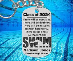 a keychain with an image of a swimming pool and the words class of 202