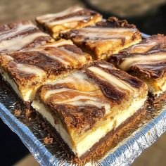 several slices of dessert sitting on top of tin foil