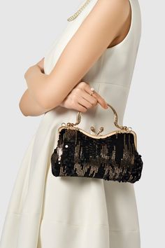 Chic, glamorous and incredibly luxurious, this flapper clutch, with its unique detailing and minimalist design, is a must for any of your big entrances. Features: Glittering sequin decoration Unique kiss lock Detachable chain strap design( Length: 47.2 inch / 120 cm) 8inch / 24.9 cm x 5.3 inch / 13.5 cm ( L x H ) Glamorous Sequined Bags For Events, Glamorous Sequined Event Bag, Glamorous Event Bags With Sequins, Black Sequin Party Bag, Sequined Party Clutch Bag, Party Clutch With Sequins, Party Clutch Bag With Sequins, Glamorous Sequin Clutch Bag, Evening Bags With Sequins For Party Season