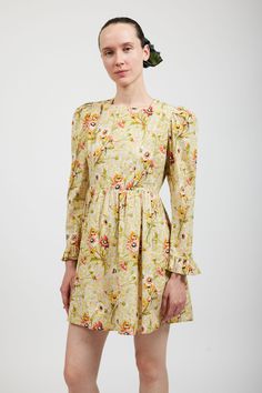 Batsheva's classic mini prairie dress with puffed shoulders and ruffles at cuffs in Laura Ashley's archival Witton Floral print. Side-seam pockets. Zip closure at back. Delicate cycle or gentle wash. Hang Dry. Model is wearing size 2 and is 5'10". Fits true to size. Made in India. 100% Cotton. Laura Ashley 90s, 90s Floral, Professional Wardrobe, Floral Squares, Jennifer Fisher, Prairie Dress, Floral Ruffle, Classic Mini, Laura Ashley