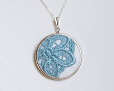 Lace necklace with ocean blue lace l016 Handmade Blue Wedding Necklaces, Handmade Light Blue Necklaces, Delicate Handmade Blue Necklace, Handmade Lace Jewelry For Gifts, Blue Round Pendant Necklaces For Weddings, Blue Round Pendant Necklace For Wedding, Delicate Blue Necklace For Wedding, Cross Stitch Necklace, Hand Embroidered Jewelry