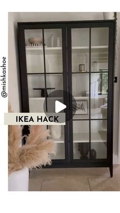 an ikea hack is displayed in front of a white wall and black glass doors