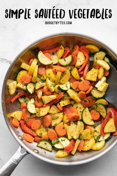 a pan filled with sliced vegetables on top of a white counter