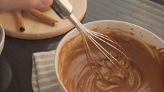 a person whisking chocolate in a bowl