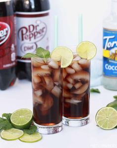 two glasses filled with iced tea and lime slices