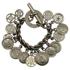 CELINE vintage silver tone spiga wheat chain link bracelet featuring numerous coin medallion charms. Toggle closure. Embossed CELINE PARIS Made in Italy. Indicative measurements : length approx. 19 cm (7.48 inches) / biggest charm diameter approx. 2.5 cm (0.98 inch). Material : Silver tone metal hardware. NOTES - This is a preloved vintage item, therefore it might have imperfections. - Colors may differ slightly from actual product appearance due to differences in lighting conditions. - As a buyer, you are fully responsible for customs duties, other local taxes and any administrative procedures related to imports into the country of destination. Luxury Vintage Engraved Charm Bracelet, Celine Bracelet, Penny Jewelry, Celine Vintage, Celine Paris, Vintage Celine, Charm Chain, Metal Hardware, Chain Link Bracelet