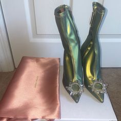 -Limited Release Begum Boot Style And Difficult To Find -Includes Box, Dust Bag And Shoes -New Condition With Some Flaws (Mentioned Below) -Eu 35 (Fit Is Slightly Small, I’d Recommend These To A Us 4 +\- 0.5 Based On How Narrow Your Foot Is) -Beautiful Iridescent Green Stretchy Latex Spandex-Like Booties -Crystal Brooch At Toe -Boots Are Very Stretchy And Have Inner Side Zippers -100% Authentic - Made In Italy Defects *Shoes Have Been Tried On Multiple Times And Display Some Slight Hairline Crea Crystal Boots, Amina Muaddi Begum, Amina Muaddi Shoes, Bag And Shoes, Iridescent Green, Boot Style, Amina Muaddi, Toe Boots, Original Character