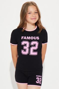 Available In Black/combo. Short Set Short Sleeve With Graphic Contrast Trim Stretch Model Wears Size L XS: (4/5), S: (6/6X), M: (7/8), L: (10/12), XL: (14/16) Mommy & Me Takedown of "Almost Famous Short Set" Disclaimer: Due To The Printing Process A Difference In Saturation May Occur. Each Garment Is Unique. Self/Contrast: 95% Cotton 5% Spandex Imported | Mini Almost Famous Short Set in Black size XS by Fashion Nova Black Spring Playwear Tops, Trendy Black Tops For School, Black Summer Tops For School, Black Spring Tops For School, Playful Black Tops For School, Playful Black Fitted Tops, Playful Fitted Black Tops, Forever 21 Black Mini Bottoms, Almost Famous