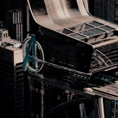 an aerial view of the top of a building with a large metal object on it's roof