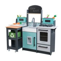 a toy kitchen with an oven, stove and sink