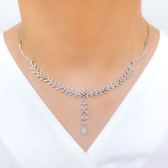 Radiant White Gold Diamond Necklace Set - the perfect addition to any sophisticated ensemble. Crafted from 18k white gold and weighing 24.1 grams, this piece features stunning round diamonds with a total weight of 2.96ct, set in a beautiful 17.5" necklace with a 1.25" drop length. It also comes with matching earrings with a length of 1.25" and screw backs for secure wearing. The lobster lock ensures this set stays safely in place, making it the perfect accessory for any occasion. PRODUCT DETAILS Exquisite White Gold Hand-set Necklaces, Exquisite White Gold Hand Set Necklace, Formal White Gold Cubic Zirconia Drop Necklace, Elegant Silver Diamond Drop Necklace, Elegant Diamond Drop Necklace For Anniversary, Luxury Hand Set Diamond Necklace, Luxury Round Diamond Necklace Hand Set, Elegant Diamond Cut Drop Necklace In Diamond White, Elegant Diamond White Drop Necklace With Diamond Cut