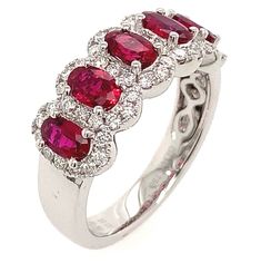 Red Ruby cocktail ring is a great way to make a statement. Slip on this ruby and diamonds ring when you want something seductive and sophisticated. The 5 stone is oval in shape and has gorgeous facets. For extra sparkle, it has been framed by round brilliant diamonds forming a beautiful halo.Metal: 18K White GoldDiamond Weight: 48 Round Brilliant Cuts 0.42ct twRuby Weight: 3 Ruby 1.25ct twRing Width: 9mm Estimated production time is 4 - 5 weeks. For desired ring size please leave us a note at th Ruby Diamond Rings, Right Hand Rings, Diamond Anniversary, Ruby Diamond, Brilliant Diamond, Round Brilliant, Cocktail Rings, White Gold Diamonds, Diamond Rings