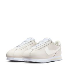 The ultimate street-style sneaker. Modeled initially as a running shoe, the Nike Cortez has become a street icon for urban neighborhoods worldwide. The lightweight feel, underfoot cushioning, and effortless style are only some of the reasons why this shoe is still so popular today. This iteration features a classic black Swoosh with a matching heel and blue midsole stripe. Inspired by the ’72 original, the foam midsole with iconic wedge insert delivers comfort from the get-go. Leather upper is e Classic White High-top Sneakers For Jogging, White Custom Sneakers With Translucent Outsole For Jogging, White Custom Sneakers For Jogging With Translucent Outsole, Modern White Running Shoes With Vulcanized Sole, Classic Running Sneakers With Translucent Outsole, Nike Urban Sneakers With Gum Sole, Classic Nike Running Shoes With Branded Insole, Nike Custom Sneakers With Rubber Sole For Jogging, Nike Sneakers For Jogging With White Sole