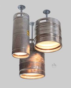 two industrial style lights hanging from the ceiling