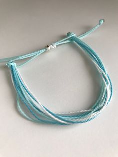 This bracelet is called ocean blues. It is made with wax string and the colors are light blue, blue, and white. This bracelet is an adjustable bracelet so it can fit any wrist size. Blue Resizable Friendship Bracelets For Beach, Blue Braided Bracelets For The Beach, Adjustable Blue Ocean-inspired Friendship Bracelets, Adjustable Ocean-colored Bracelets For The Beach, Adjustable Blue Ocean-inspired Bracelet, String Bracelet, Braided Bracelets, Adjustable Bracelet, Blue Ocean