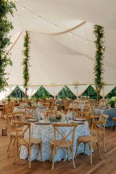 a large tent with tables and chairs set up for an event