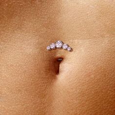 Introducing our stunning Belly Button Ring, a true beauty in navel piercing jewelry. Crafted with precision from ASTM F136 G23 Implant Grade Titanium, this exquisite piece is perfect for both women and men (unisex). This Threadless Floating Convex Base Belly Button Ring features 5 Round Bezel Set Cubic Zirconia, adding a touch of brilliance to your look. With a 14 Gauges (1.6mm) thickness and a comfortable 5/16" (8mm) length, it promises an enjoyable wear. Choose from a range of captivating colo Summer Belly Button Rings, Button Tattoo, Mid Finger Rings, Navel Piercing Jewelry, Titanium Belly Ring, Bellybutton Piercings, Belly Button Piercing Jewelry, Navel Jewelry, Ear Piercings Cartilage