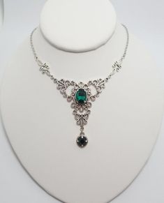 This is a new handmade necklace. It is made with antiqued silver plated filigrees, accented with high quality EMERALD GREEN glass jewels/rhinestones that sparkle like crystals. Decorated portion is 4 1/2" wide and 2 1/4" tall in the center. Necklace is adjustable 15-18" with a lobster clasp and chain extender. If you would like a different length, please send us a message.Matching earrings and headpiece are listed in our store in a variety of stone colors. If you don't see items with a color you Antique Silver Necklace, Rainbow Topaz, Choker Pendant, Topaz Color, Chain Extenders, Crystal Ab, Necklace Choker, Custom Bracelets, Silver Filigree