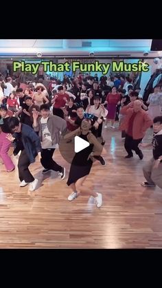 a group of young people dancing on top of a wooden floor in front of a crowd