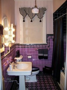 an image of a bathroom setting with purple and black tiles on the walls, sink, mirror and tub