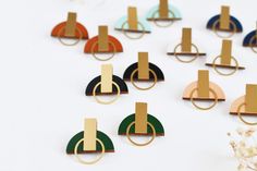 Minimalist earrings | Geometric earrings | Geometric studs Geometric earrings in hand-painted wood with warm gold-plated brass detail. Perfect for geometric lovers, these beautiful studs are inspired by architecture and ancient egyptian symbols. Thanks to the simple shape, they are feminine and sophisticated. These geometric earrings are designed for the modern woman. They will give a unique touch to your outfit. The wooden packaging makes the stud earrings a lovely and original gift too! Geomet Diy Soda, Geometric Jewellery, Navy Earrings, Modern Hoop Earrings, Wooden Packaging, Ancient Egyptian Symbols, Brass Detail, Enamel Stud Earrings, Unisex Earrings