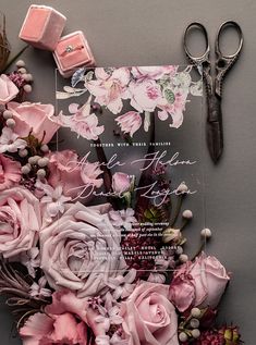 the wedding stationery is surrounded by pink flowers and other things to do with it