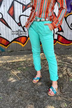 Our Turquoise Creek Pants are the perfect addition to any outfit! These turquoise bottoms feature functional buttons, a stretchy waist-band and deep pockets for added convenience. Plus, the true-to-size stretchy fit ensures you'll feel comfortable and confident all day long. Make a statement with these pants! 98% Cotton, 2% Spandex Green Relaxed Fit Bottoms With Button Closure, Stretch Turquoise Bottoms For Spring, Casual Turquoise Pants, Turquoise Bottoms With Pockets For Summer, Turquoise Summer Bottoms With Pockets, Casual Turquoise Summer Pants, Casual Bodysuit, Belt Top, Kimono Duster