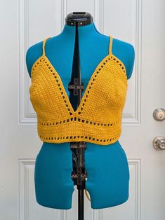 Extra Large handmade crochet top with lace-up back in yellow. 100% cotton. Measurements: Bottom Band  Length - 31" Bottom Band Height - 3" Cup Height (excluding bottom band) - 9" Cup Width (each) - 9.5" For best care, hand wash or machine wash with cold water in delicates bag on a gentle cycle and lay flat to dry. Made from Lilly pattern by Kelsie at PassioKnit Goods, passioknitgoods.com. Festival Crochet V-neck Crop Top, Yellow Sleeveless Crochet Lace Top, Sleeveless Yellow Crochet Lace Top, Yellow Crochet Lace Cotton Top, Yellow Bohemian Crochet Top For Festival, Fitted V-neck Crop Top With Crochet Trim, Yellow Cotton Top With Crochet Lace, Yellow Triangle Top For Spring, Casual Crochet Lace Triangle Top