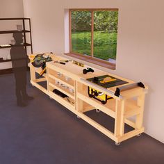 a man standing in front of a workbench with tools on it and an open window