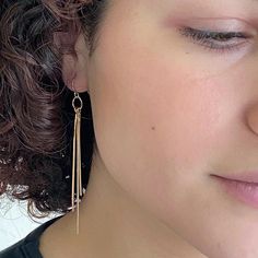 Close up front view of woman wearing pair of gold dangle earrings with three varied length square wires. Single Earring, Wire Earrings, Gold Drop Earrings, The Room, Gold Filled, Night Out, Pearl Earrings, Hoop Earrings, Sparkle