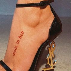 a woman's foot with a tattoo on her left ankle and the words hope in red ink