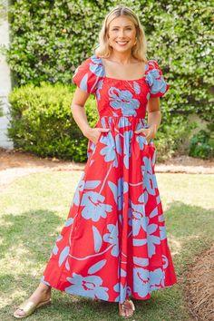 PROVEN, BEST-SELLING FIT! Perfectly bold with a side of sweetness, this red maxi is covered in a large-scale blue floral print. Maxi features a flattering and comfortable stretchy smocked bodice that flows into an A-line skirt. Short balloon sleeves add to the cuteness, and side pockets complete the look.  Pull-on fit Side pockets Smocked bodice Elastic trim on shoulders Elastic sleeve cuff Fabric content: Self- 100%... Red Smocked Back Maxi Dress For Summer, Casual Red Maxi Dress With Smocked Back, Red Maxi Dress With Smocked Back For Beach, Red Fitted Maxi Dress With Smocked Back, Red Maxi Dress With Smocked Back For Vacation, Red Smocked Bodice Maxi Dress For Summer, Red Maxi Dress With Smocked Bodice For Summer, Red Maxi Dress With Smocked Back, Spring Red Maxi Dress With Smocked Bodice